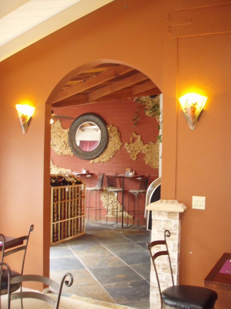 Archway between wine store and restaurant