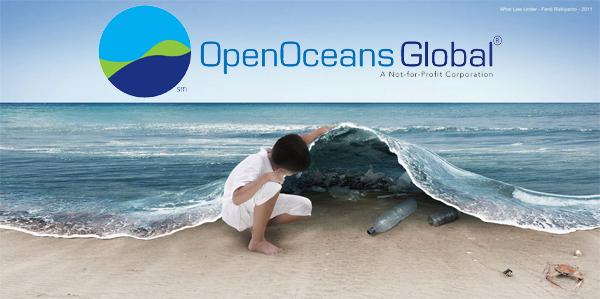 Child looking under a wave with OOG Horizontal Logo.jpg
